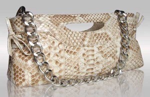 Beige color python leather clutche